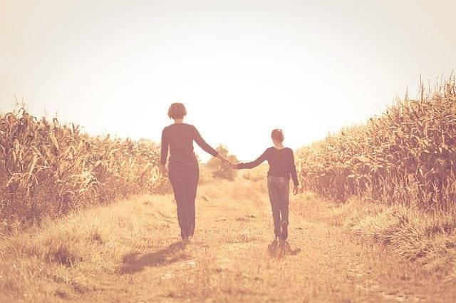 Mother and Child holding hands