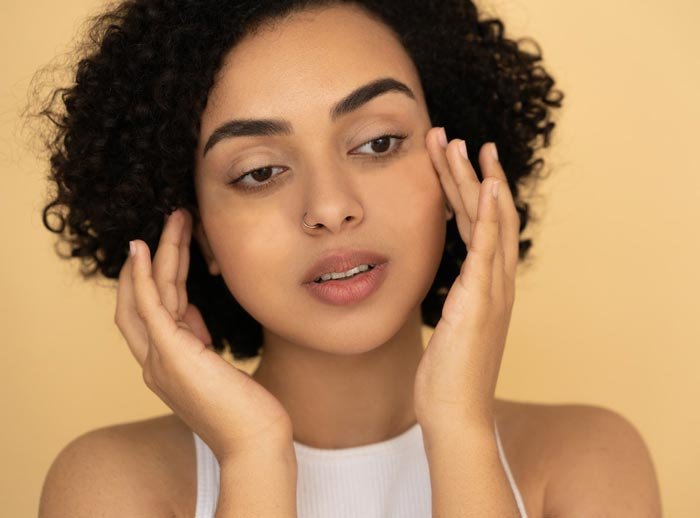 Tapping on EFT point on the side of the eye