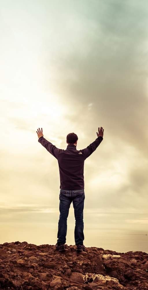 healing client celebrating success - clouds background