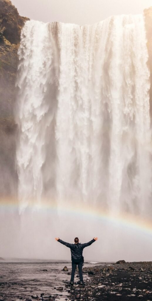 healing client celebrating success - waterfall background