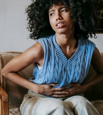 woman in discomfort suffering with crohn's disease